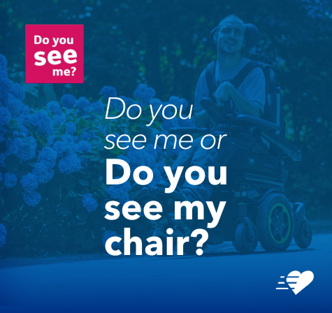 Smiling man in a powered wheelchair on a path with flower bushes behind, overlaid with the question “Do you see me or do you see my chair?” as part of the Learning Disability Week campaign.